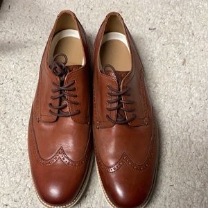 Cole Haan leather wing tips.